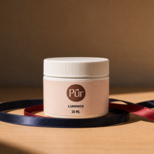 Pürveyor Luninous 30ML creme jar on warm ribbon background